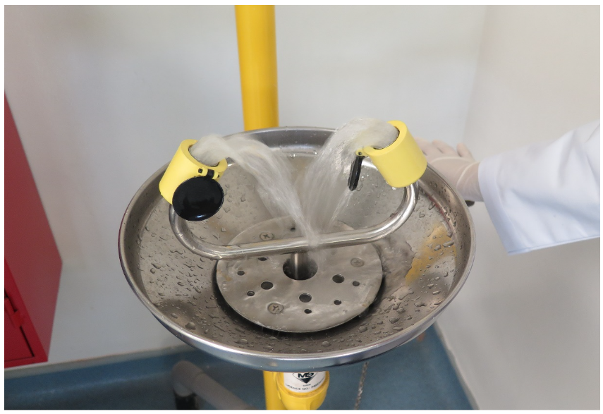 Eye wash in use, both nozzles running